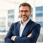 Smiling European employer in a blue blazer with arms crossed